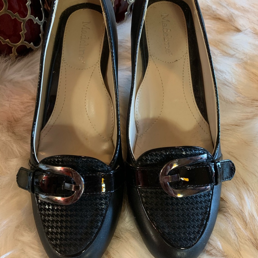 Black buckle heels.